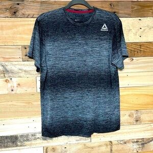 Reebok size medium gray and black short sleeve workout shirt dry wick